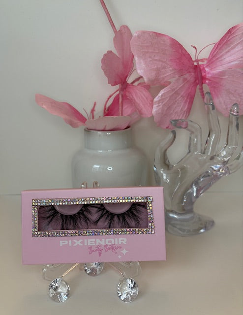 Luxury real mink lashes in a stylish pink box, perfect for achieving soft, natural glam looks.