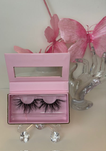Luxury real mink lashes in a stylish pink box, perfect for achieving soft, natural glam looks.