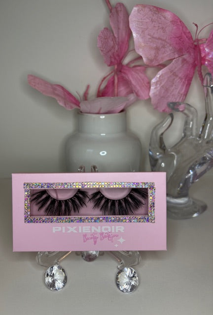 Roux lash set in luxe pink packaging with bold lashes, showcasing sultry design and refined elegance.