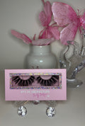 Roux lash set in luxe pink packaging with bold lashes, showcasing sultry design and refined elegance.