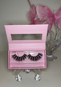 Roux luxurious mink eyelashes in pink box, showcasing bold and sultry lash design for a refined look.